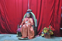 She does not attend school, does not learn to walk until she reaches puberty. Once she begins to menstruate, she goes through a 12 day ritual, marking the end of her life as a little goddess. Worshiped by the Hindus as well as the Buddhists. I have never seen someone so bored as this young girl.