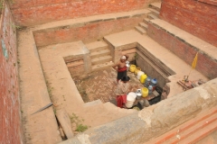 Women lined up early in the morning to get their water from the local well