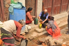 He is selling fuel to the ladies for cooking
