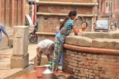 Pulling a container from the well full of water