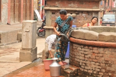 Pulling a container from the well full of water