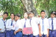 Group of school boys collecting for a local charity on the island
