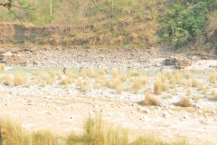 Guides deflating our rafts so no one will come along and try and take them. During the rainy season the river will be bank to bank and moving very fast. The weather will be much colder then too.