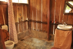 The delux outdoor bathroom. Make sure you lift the lid if you need to sit on the toilet as those sucker red ants move fast as they circle the toilet in the mornings. You chase them out of the shower too. All and all I enjoyed staying there.