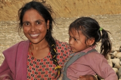 I had just shown to the mother a photo of herself in the camera that I had previously taken of her. She looked longly at herself and began to cry. With the help of our guide I told her she was beautiful. I tried to find a way to get a copy of the photo to her but there was no mail or way to do it.