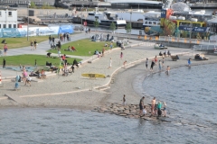 Small man made beach in the harbor area next to the Oslo Opera house.