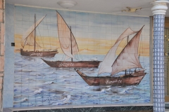 Tile works showing Dhows on the side of a home