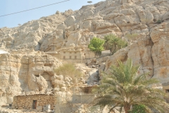 Homes built high up from an aroyo away from rushing water during rainy periods