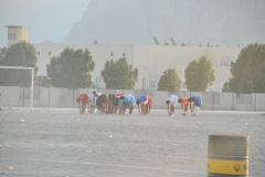 Young players stopping for prayer before the game