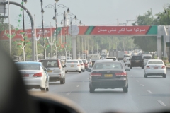 Muscat traffic with feltive holiday decorations for a local holiday