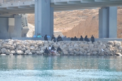 Group of local village ladies relaxing on the waters edge