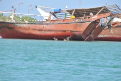 Workers in the water working on the Dkhows