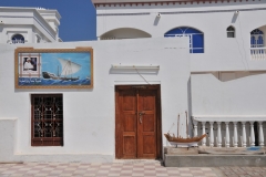 The house with tile work of the Sultan Qaboos on the front of the house