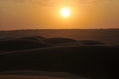 Sunset with the blowing sands
