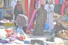 There is a community atmosphere in the air where the women chat, work and sell while their children amuse themselves with the wares.