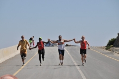Ran across a runing club from Muscat that were running from the bottom of an extreme mountain base to the top. The road was a narrow dirt road with many sheer cliffs to be navigated. They ran Up the mountain.