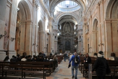 The building consisted of a friary capable of sheltering 330 friars, along with a royal palace. The chapel  or church included six monumental pipe organs and the two carillon.