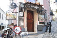 Narrow entrance to a corner Cantina after climbing a  number of stairs with more to go higher also.