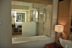 Inside the hotel room in Doha. Strangest window in a bathroom and bedroom. Between the two rooms