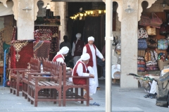 Workers waiting to carry all that you buy in the Souq Waqif