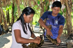 Unwrapping the cooked banana leaves