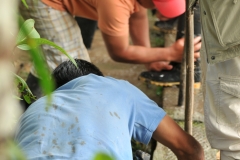 Cleaning off our boots from all the mud