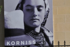 Bill board on the side of a building in Revolution Square showing today's style for ladies.