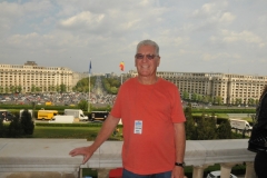 A local tourist taking in the sights from the infamous balcony at the Parliment Palace.