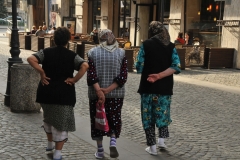 Three local ladies walking and talking in the old part of town. Notice the