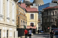 Leaving the Cathedral and walking down the street past a Mosque.