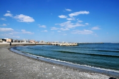 This is a beach for tourists. Behind us was a large hotel undergoing renovation. It was very drab looking.