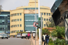 The buildingis the City Hall. Rwanda's developing economy suffered heavily in wake of the 1994 genocide, but has since strengthened. The economy is based mostly on subsistence agriculture. Coffee and tea are the major cash crops for export. Tourism is a fast-growing sector and is now the country's leading foreign exchange earner. Rwanda is one of only two countries in which mountain gorillas can be visited safely, and visitors pay high prices for gorilla tracking permits.