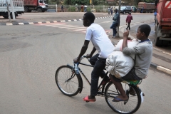 Here we see a moto bicycle, cheaper,  in stead of a moto cycle.  both  transportation.