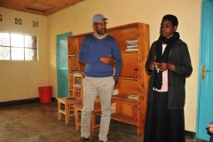 The last morning of the trip we were fortunate to visit a school only a few minutes from the hotel.  The school is Rushubi Primary School Juru, The School is a Government Sponsored School.  In the photo is Sam our Guide and the Principal of the school. Behind them is the entire library for the school.