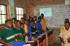 The classrooms were very neat and orderly. The teachers wore a white smock over their clothing.