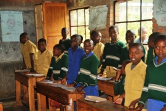 The boys in the yellow were also excited to sing along too. Notice the kids outside looking in from other classes.