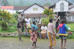 The locals were dance to music played by a couple of the locals.