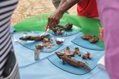 A local lady displaying for us the fish after they have been cooked. They were very good.