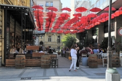Cool looking outdoor restaurant with umbrellas inverted upside down for  shade.