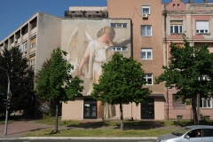 Art work on the side of Soviet era apartment buildings.