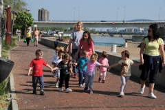 Pre school children walk along the Danube with their teachers enjoying the day.