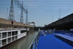 We are now looking at the Aft or rear of the ship that is now inside a lock being raised or flooded.