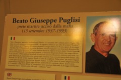 He spoke out against the Mafia who controlled the area and opened a shelter for underprivileged children. Puglisi had been offered other parishes by the local curia, in less troublesome Palermo neighborhoods, but he opted for San Gaetano. On 15 September 1993—Puglisi's 56th birthday—he was killed outside his home by a single bullet shot at point-blank range. He was taken unconscious to a local hospital, where surgeons could not revive him. One of the hitmen who killed Puglisi, Salvatore Grigoli, later confessed and revealed the priest’s last words as his killers approached: "I've been expecting you."