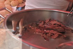 Cooking intestines for a sandwich which is a local favorite.