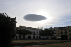 As we stopped at one of the neighborhoods in the city of Palermo we were treated to a strange cloud formation in the sky with the sun setting behind it.