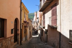 Walking up the narrow streets of Castelbuono lets you know it is centuries old .