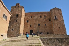 The Museo Civico of Castelbuono is a municipal institution containing  the historical and artistic heritage located in the Ventimiglia Castle. The entrance has many stairs to the main door. Construction of the Castle began in 1316,  over the ruins of the ancient Byzantine town of Ypsigro, high on the San Pietro hill. Hence its original name, Castello del buon aere , Castle of Good Air.