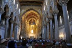 The main internal feature is the large extent glass mosaics.  With the exception of a high chair rails,  made of marble slabs with bands of mosaic between them, the whole interior surface of the walls, including soffits and jambs of all the arches, is covered with minute mosaic-pictures in bright colors on a gold ground. The mosaic pictures, depicting stories from both the Old and New Testament, are arranged in tiers, divided by horizontal and vertical bands