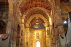 The half dome of the central apse has a colossal half-length figure of Christ, with a seated Virgin and Child below; the other apses have full-length figures of St Peter and St Paul.