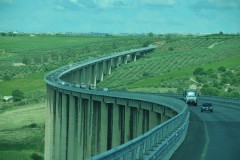 Looking out the back of the bus the construction of bridges in Sicily.